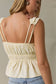 Butter Sleeveless Peplum Top